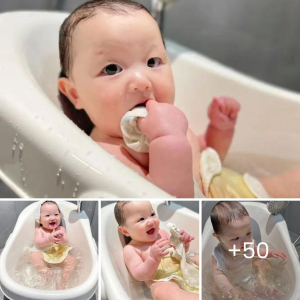 "Enchanting Bath Time: Baby's Joyful Splashes Bring Heartwarming Delight"